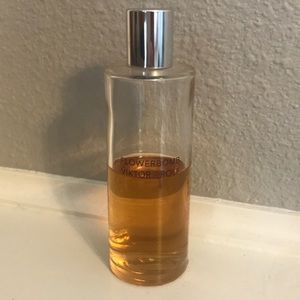 HALF USED REFILL BOTTLE OF FLOWER BOMB